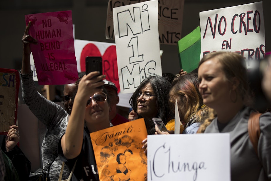 caption: A crowd gathers on Tuesday, June 26, 2018, to show support for Maru Mora-Villalpando during an ICE hearing outside of the Immigration Court building on 2nd Avenue in Seattle. 