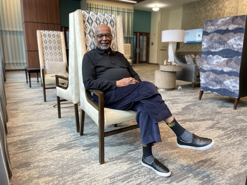 caption: Norm Rice at the retirement home tower where he lives on First Hill.