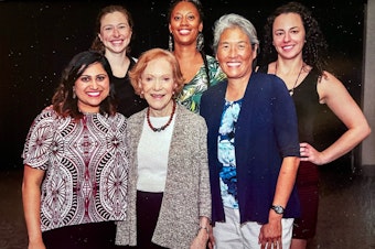 caption: Former First Lady Rosalynn Carter poses with 2018-2019 Rosalynn Carter Mental Health Journalism Fellows, including KUOW's Deborah Wang, second from right.