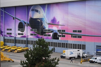 caption: A worker walks into Boeing's factory, Tuesday, Sept. 24, 2024, in Renton, Wash. 