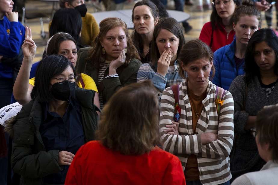 caption: Seattle parents address Seattle Public School officials after questions regarding the closure of 20 elementary schools were not allowed during a ‘Well Resourced-Schools Community Meeting,’ on Tuesday, May 28, 2024, at Roosevelt High School in Seattle. 