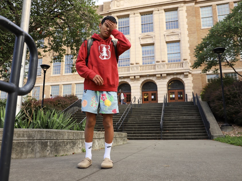 caption: Alex Kaneshiro, a ninth-grader at Roosevelt High School in Seattle, wore a Stanford hooded sweatshirt, Birkenstock shoes, and Vans shorts on his first day of school, September 4, 2024.
