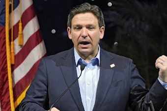 caption: Florida Gov. Ron DeSantis speaks at a Feb. 8 luncheon in Tampa, Fla. Climate change will be a lesser priority in Florida and largely disappear from state statutes under legislation signed Wednesday by DeSantis.