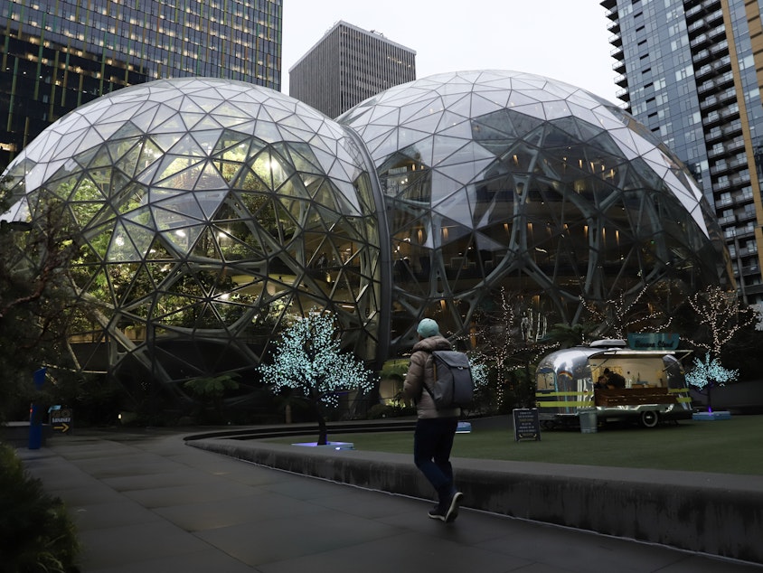 caption: Amazon's iconic spheres in downtown Seattle Thursday, the first day the company started enforcing a five-day-a-week return-to-office policy.