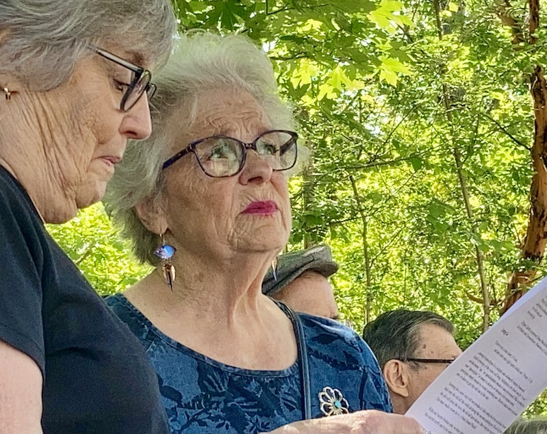 caption: Molly Hoffman watches as the University Temple United Methodist Church is demolished on June 18, 2021. She was baptized and married in the church — and she always thought her memorial service would be held there.