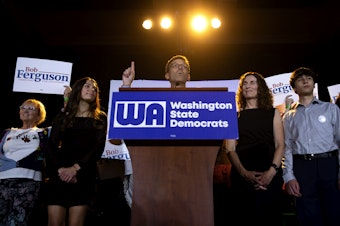 caption: Democratic governor candidate Bob Ferguson speaks to a large crowd on Tuesday, November 5, 2024, during the Washington Democrats election night party at the Seattle Convention Center in Seattle. 