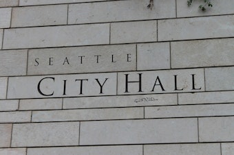 caption: The sign at Seattle City Hall. 