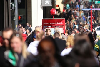 caption: People walking in Seattle