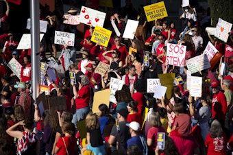 caption: Hundreds of Seattle Public Schools students and parents gathered for a rally demanding that schools remain open, ahead of the Seattle Public Schools board meeting on Wednesday, September 18, 2024, at the John Stanford Center for Educational Excellence building in Seattle. 