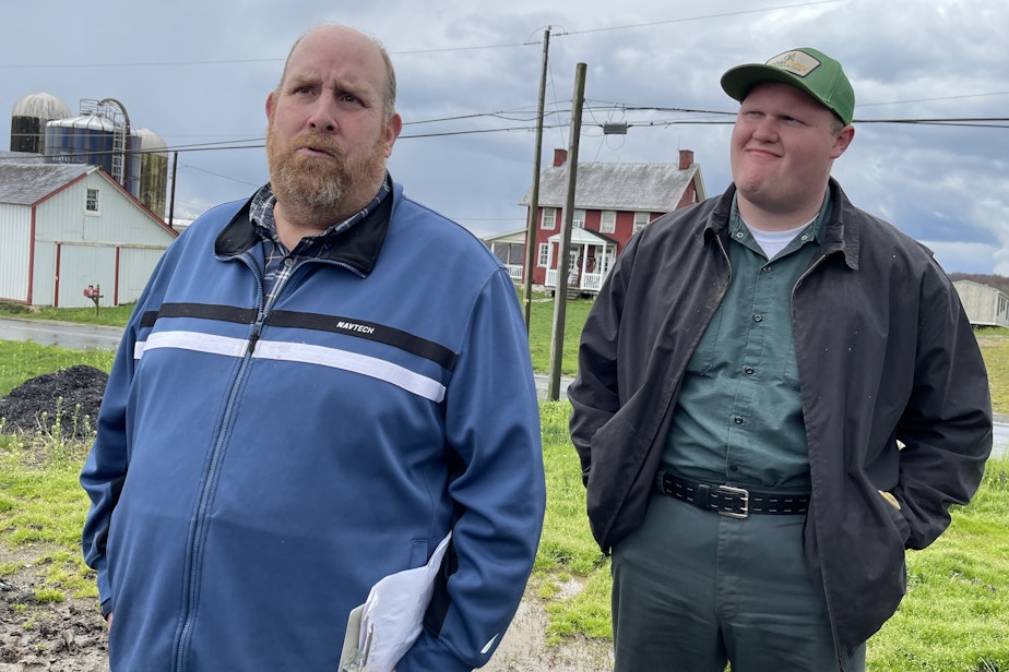 caption: Father-and-son farmers Brian Eckman and Lane Eckman at their farm in Peach Bottom, Pennsylvania, on April 4, 2024.