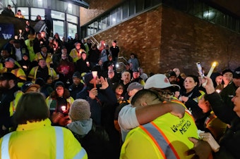 caption: Metro bus drivers gather at tribute to Shawn Yim on Dec. 21.