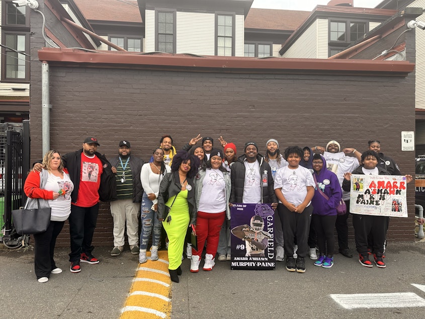 caption: Amarr Murphy-Paine's family posed for a portrait outside El Centro de la Raza in Seattle on November 2, 2024.