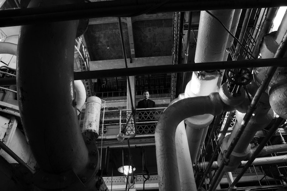 caption: Actor Ray Tagavilla on a catwalk in the historic Georgetown Steam Plant.