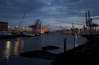 caption: The sun rises over the Duwamish Waterway as seen from the West Seattle Bridge Trail on Thursday, October 4, 2018, in Seattle. 