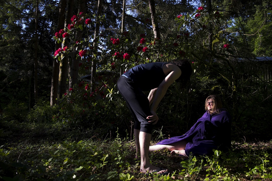 caption: Hope Black breathes through a contraction with her husband Jake, left, while in labor at 7:18 a.m. on Friday, May 28, 2020, in the backyard of their home on Vashon Island. 