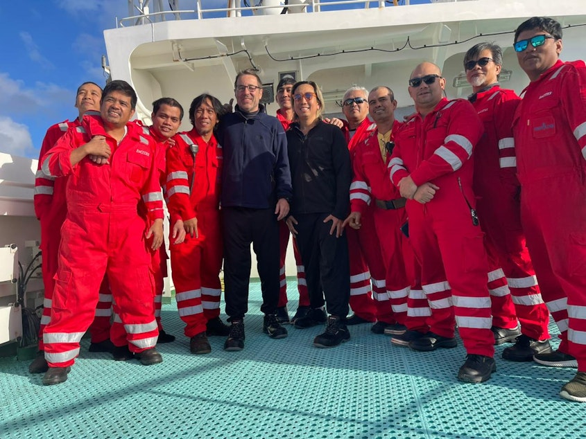 caption: Balthasar Wyss of Mercer Island, Washington, and Marcelo Osanai, of Brazil, after being rescued in the south Atlantic Ocean. Their rescuers were aboard the Front Pollux, an oil tanker.