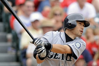 caption: FILE - Seattle Mariners' Ichiro Suzuki, of Japan, hits a solo home run during the sixth inning of a baseball game against the Los Angeles Angels, Sunday, May 31, 2009, in Anaheim, Calif.