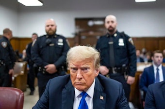 caption: Former U.S. President Donald Trump sits at the defendant's table inside the courthouse as the jury is scheduled to continue deliberations for his hush money trial at Manhattan Criminal Court on May 30, 2024 in New York City.
