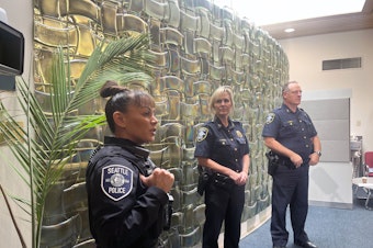 caption: Seattle Police held a press conference on Wednesday, Oct. 25, about a recent spate of robberies targeting students in North Seattle. From left, Detective Judinna Gulpan, Captain Lori Aagard, and Assistant Chief Todd Kibbee.