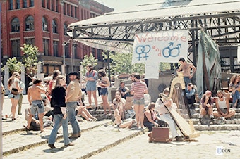 caption: People gathered for Gay Pride Week’s Occidental Square picnic on June 29, 1974. 
