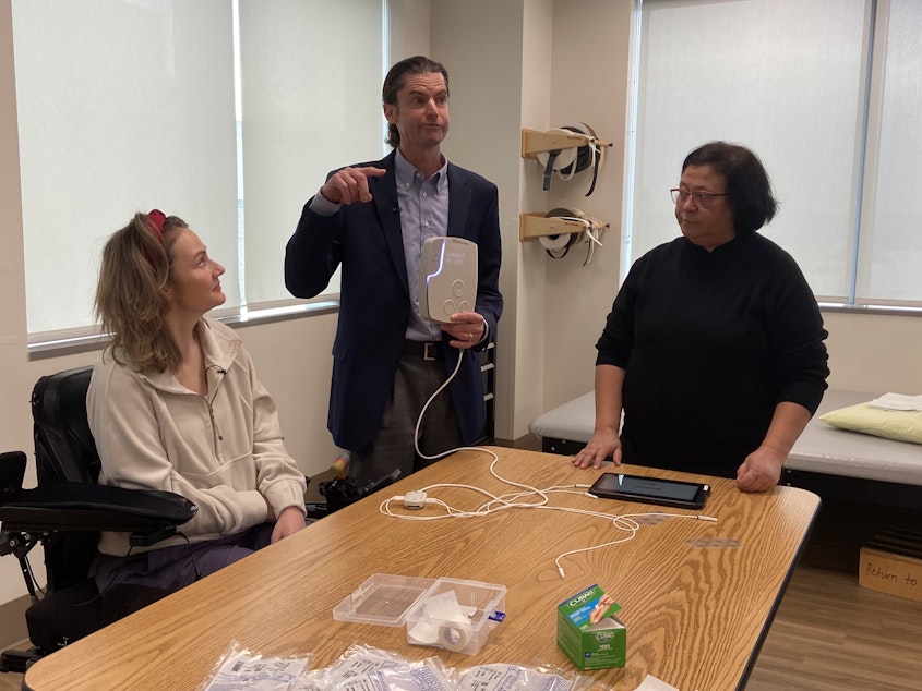 caption: Jessie Owen, left, pictured with UW Medicine professor Chet Moritz (center) and Dr. Fatma Inanici (right).