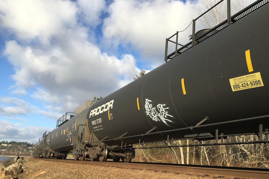 caption: A oil train heads south toward Seattle on Jan. 18, 2021, in Shoreline, Washington. 