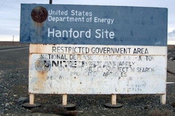 caption: Highway sign on a road entering the Hanford Site