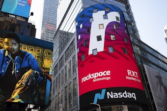 caption: A Nasdaq sign in Times Square in New York promotes an upcoming listing on Aug. 5, 2020. Nasdaq said it will push for a rule requiring listed companies to include at least one woman and one minority or LGBTQ+ person. (AP Photo/Mark Lennihan)