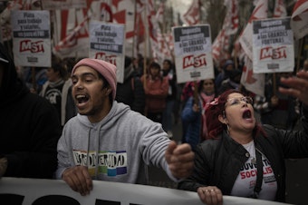 caption: Large numbers of workers from different sectors protest against inflation and in favor of higher wages in Buenos Aires, Argentina, on Aug. 17, where inflation has soared.