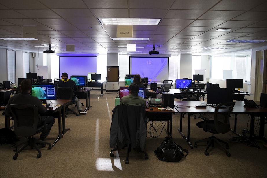 caption: Employees work at the elections command post at the FBI Seattle field office on Monday, November 4, 2024, in Seattle. 