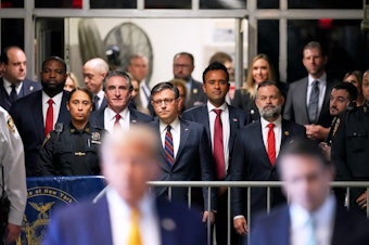 caption: Rep. Byron Donalds (R-Fla.), vice president hopeful North Dakota Gov. Doug Burgum, House Speaker Mike Johnson, former GOP presidential candidate Vivek Ramaswamy and Rep. Cory Mills (R-Fla.) joined the former president in court Tuesday morning.