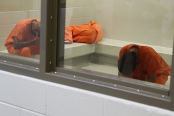 caption: Immigrants await processing at an Immigration and Customs Enforcement (ICE) detention center in Adelanto, California. By filing a lawsuit under the Freedom of Information Act, NPR obtained a trove of inspection reports detailing serious problems at this ICE facility and others across the United States.