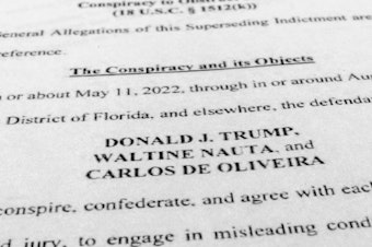 caption: Former President Donald Trump, aide Nauta and Mar-a-Lago property manager Carlos de Oliveira face some 40 criminal counts over classified documents found at Trump's Florida residence and club.