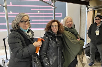 caption: Courtroom sketch artists Elizabeth Williams (from left), Jane Rosenberg and Christine Cornell wait to enter the Manhattan courthouse where former President Donald Trump's trial is occurring on April 25.