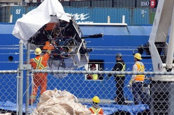 caption: Debris from the Titan submersible, recovered from the ocean floor near the wreck of the Titanic, is unloaded from the ship Horizon Arctic at the Canadian Coast Guard pier in St. John's, Newfoundland, Wednesday, June 28, 2023.