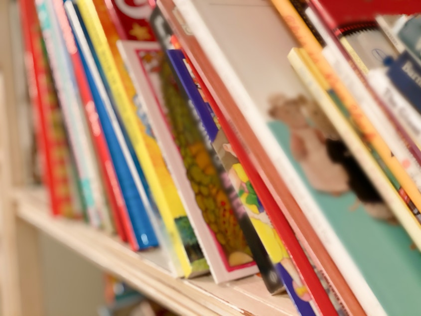 caption: Scholastic says it will stop offering the controversial collection of race- and gender-related titles at middle school book fairs starting in January.