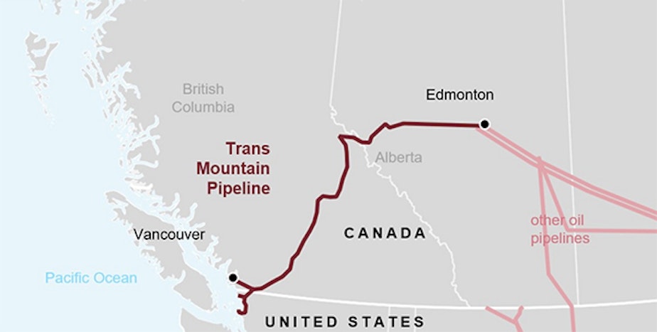 caption: The newly expanded Trans Mountain Pipeline carries crude oil from northern Alberta to a saltwater terminal just outside Vancouver. A limited-capacity spur off of the original pipeline crosses the border to serve four oil refineries in Whatcom and Skagit counties.