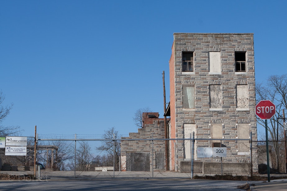 caption: A vacant Baltimore rowhouse in 2013