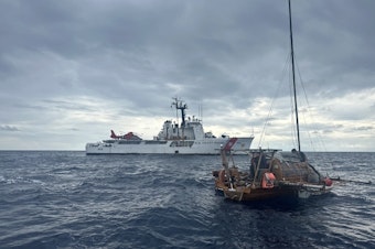 caption: The U.S. Coast Guard Cutter Active rescued a German sailor from his wooden sailboat off Ecuador's Galapagos Islands on April 13, 2024.