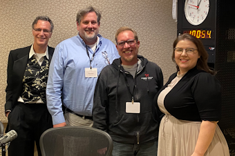 caption: Bill Radke discusses the week’s news with Washington Policy Center’s David Boze, The Needling’s Lex Vaughn, and Seattle Times Patrick Malone. 