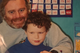 caption: Martin McGowan, left, a former teacher at West Woodland Elementary School in northwest Seattle, pictured here with first-grader Roman Harto in 2003.