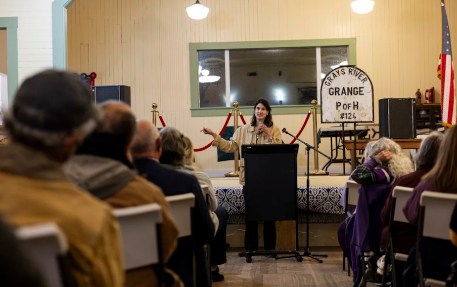 caption: Marie Gluesenkamp Perez speaks during a community forum in Grays Water, Washington, on Oct. 22, 2024 during the race for Washington's 3rd Congressional District.