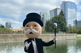 caption: Mr. Monopoly stands in Bellevue's Downtown Park, Sept. 13, 2024, to announce that Bellevue was selected to be featured as board game's next city edition. Designers are asking locals about what aspects of the city they would like included in the game. Bellevue Monopoly is expected in spring of 2025. 