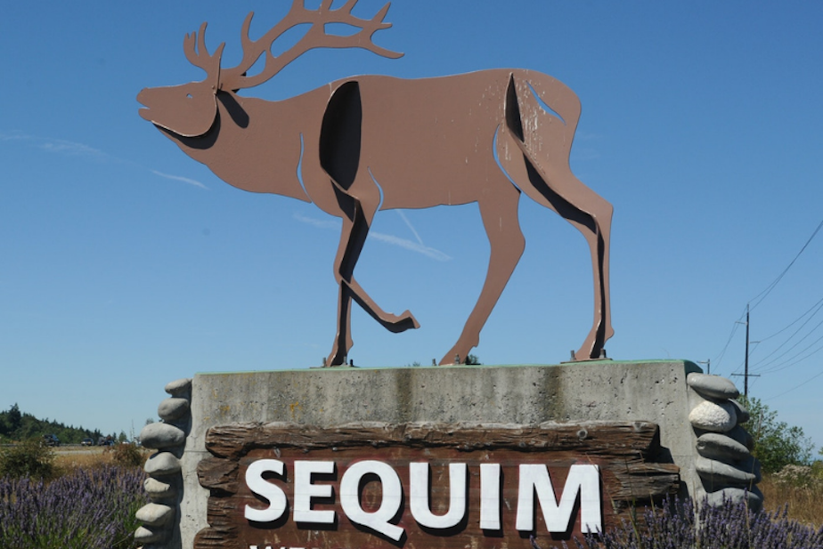 caption: A sign on Highway 101 welcomes visitors to Sequim, Washington. 